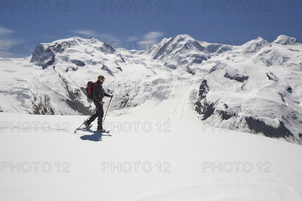 Snowshoeing in the Gornergrat region with views of the surrounding mountains and the Gorner Glacier, Zermatt, Valais Canton, Switzerland