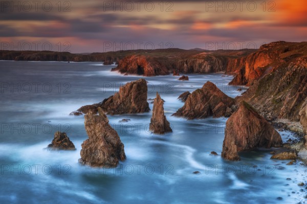 Sunset over the towering Stacks of Mangersta, with dramatic cliffs and rugged coastline, Atlantic Ocean, Outer Hebrides, Scotland, UK