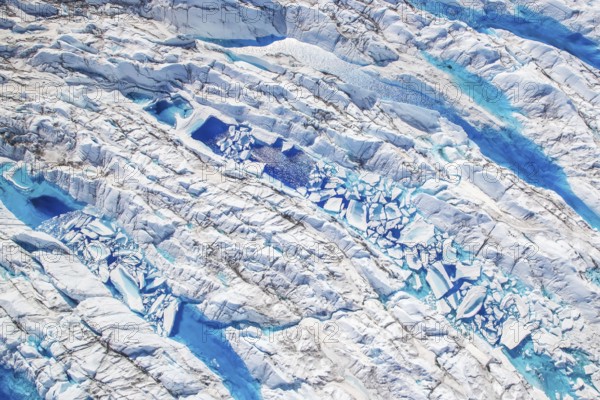Surface meltwater on the Greenland Ice Sheet, visible impact of climate change, Aerial view, Arctic, Greenland, Geographically in North America, politically part of the Kingdom of Denmark