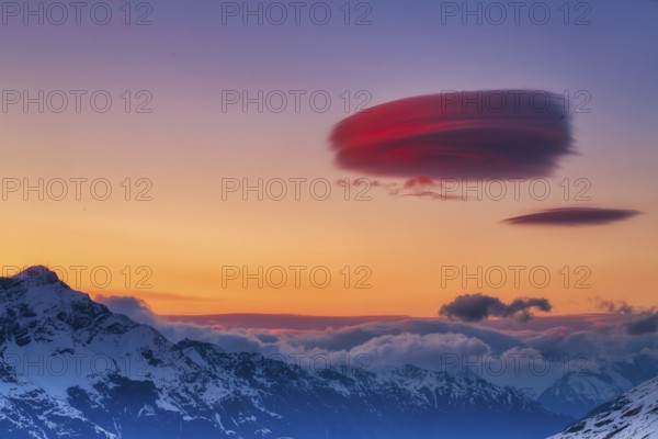 Lenticular clouds over Zermatt at sunset in winter, Valais, Switzerland