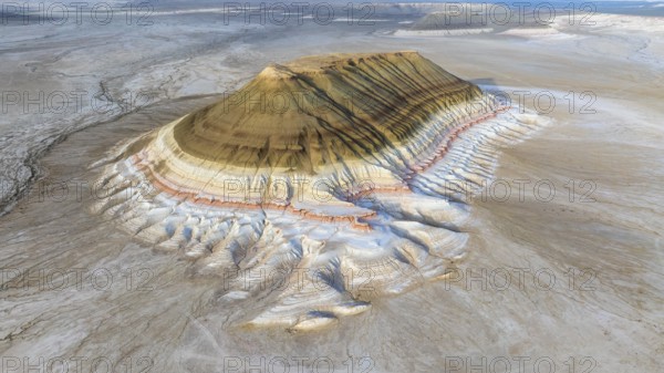 Aerial view of Mount Bokty, isolated sandstone mountain rising above the desert landscape, Mangystau Region, Kazakhstan, Asia