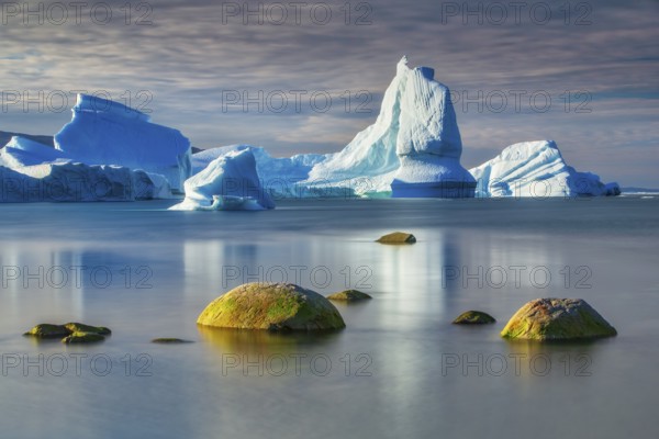 Icebergs floating in the bay near Ataa Village, Disko Bay, Arctic, Greenland, geographically part of North America, politically part of the Kingdom of Denmark
