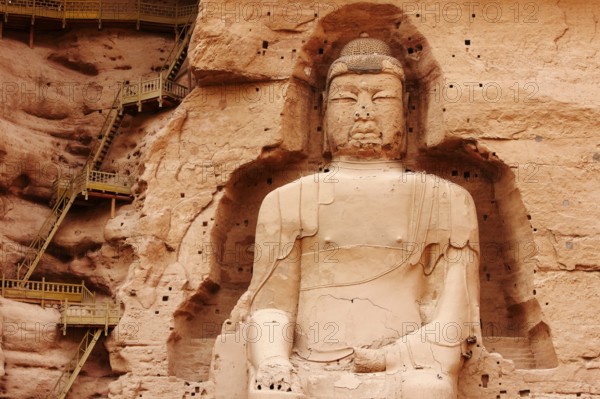 Along the Yellow River, a series of grottoes filled with Buddhist sculptures, including the giant Maitreya Buddha at Binglíng Sì, over 27?m tall (almost 100?ft), Gansu Province, China, Asia