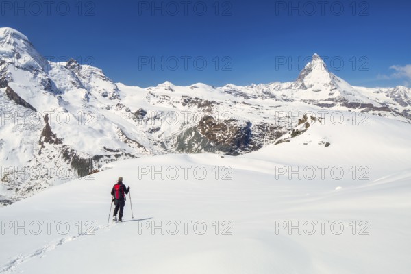 Snowshoeing in the Gornergrat region with views of the surrounding mountains and the Matterhorn, Zermatt, Valais Canton, Switzerland