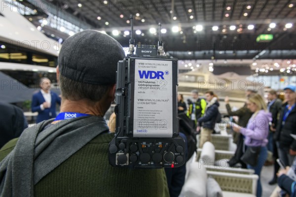 Press photo Cameraman from Westdeutscher Rundfunk WDR producing coverage by Messe Boot, Düsseldorf, North Rhine-Westphalia, Germany