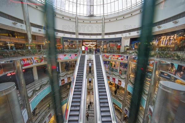 Large shopping center with multiple levels of shops and escalators, London, England, United Kingdom