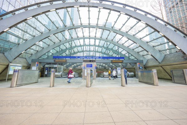 A modern building entrance with a glass roof and deserted escalators, London, England, Great Britain