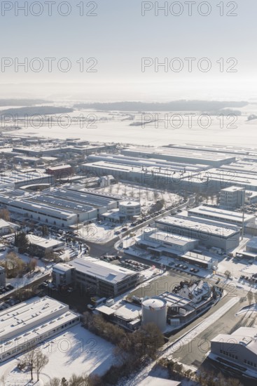 Snowy industrial area in Europe with numerous buildings and clear skies, Wolfsberg industrial area, Nagold, Germany