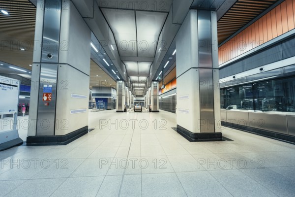 Empty train station with modern architecture, wide corridors and bright lighting conditions, London, United Kingdom