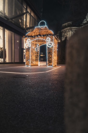 Festively illuminated pavilion at night, decorated with decorative lights, London, England, Great Britain