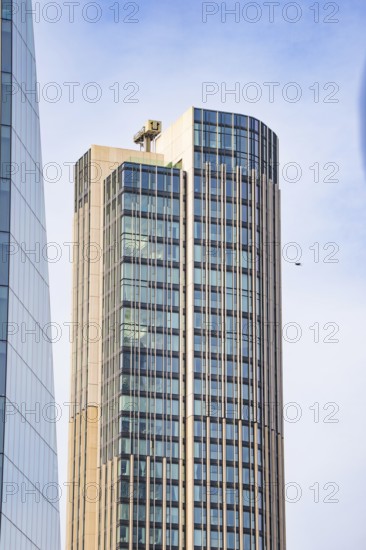 A modern high-rise building with glass façade stretches skyward, London, England, Great Britain