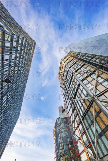 View between two modern skyscrapers in the blue sky, London, England, Great Britain