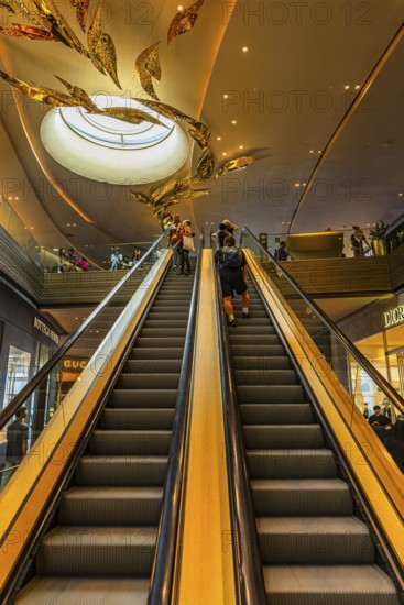 Escalator and ornate ceiling light in Iconsiam shopping center, Bangkok, Thailand's metropolis, Thailand