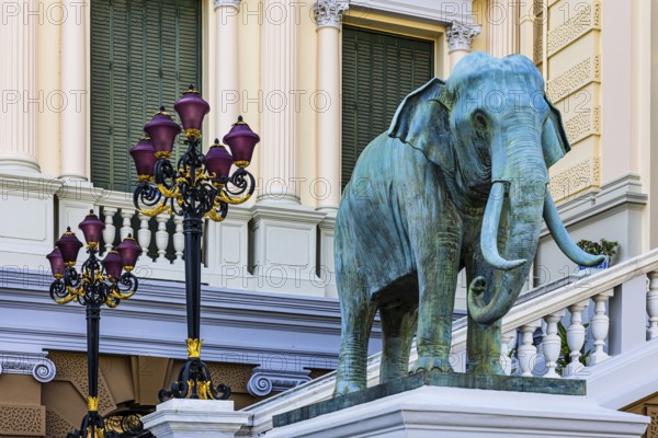 The Grand Royal Palace, an elephant statue and multi-armed lanterns decorate the side entrance of the Chakri Maha Prasad throne hall, Phra Nakhon, Bangkok, Thailand's metropolis, Thailand