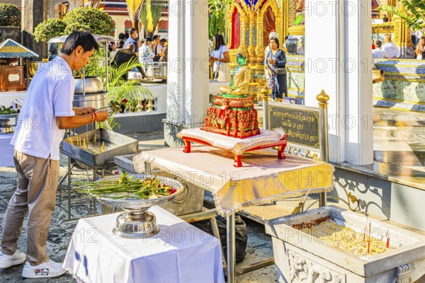 The Grand Royal Palace, Wat Phra Kaeo Buddhist Temple, believers bring flowers as offerings, Phra Nakhon, Bangkok, Thailand's metropolis, Thailand