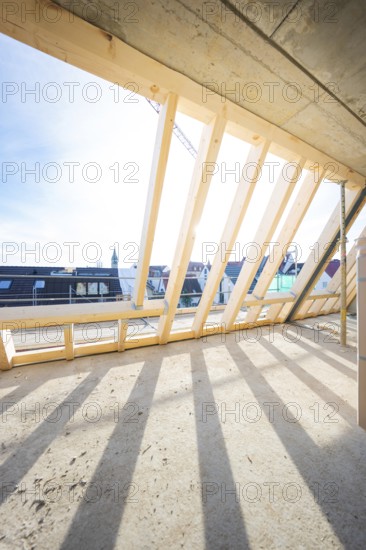 Roof truss with wooden structure and shade under sunny sky, carpentry, renovation, roof extension, Stuttgart, Germany