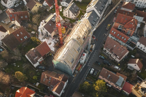 Bird's-eye view of residential area with focus on a construction site and surrounding houses, carpentry, renovation, roof extension, Stuttgart, Germany