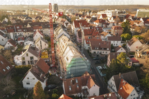 View of a city with a construction site in a residential area and surrounding countryside, carpentry, renovation, roof extension, Stuttgart, Germany