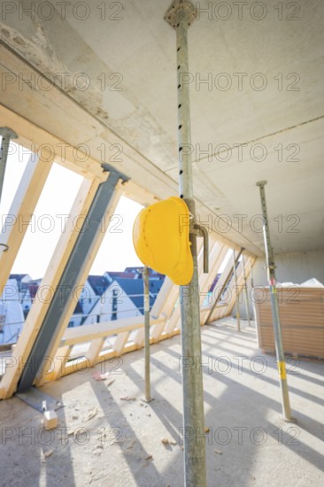 Shell with wooden roof racks and construction site safety equipment indoors, carpentry, renovation, roof extension, Stuttgart, Germany