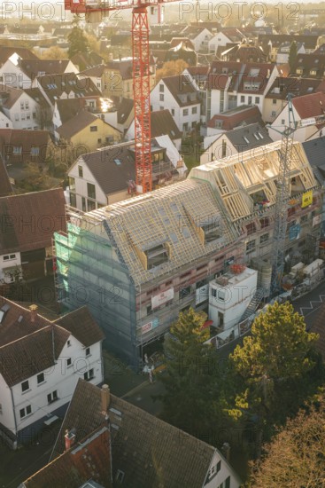 Panoramic view of a construction site in a residential area doing roofing work in an urban environment, carpentry, renovation, roof extension, Stuttgart, Germany