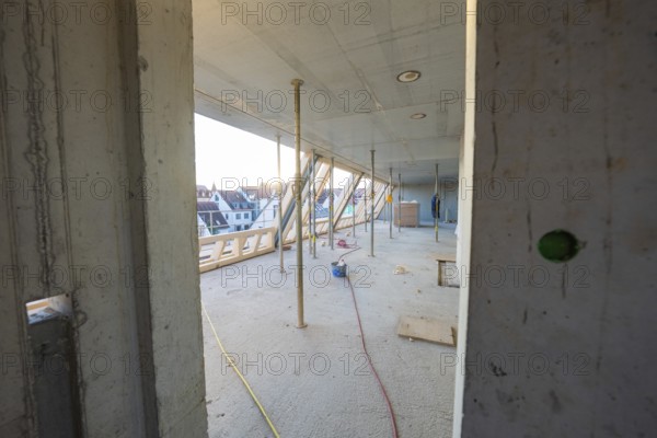 Semi-finished interior of a construction site with exposed structure and supports, carpentry construction, roof extension, renovation, Stuttgart, Germany
