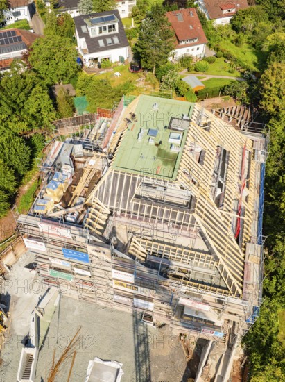 Aerial view of a construction site in a residential area with progressive building construction, construction site of a carpentry workshop, roof extension, renovation, Stuttgart, Germany