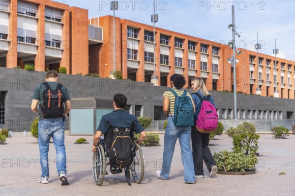 Diverse group of college students, including one using a wheelchair, walking together on a modern university campus, showcasing inclusive education and friendship