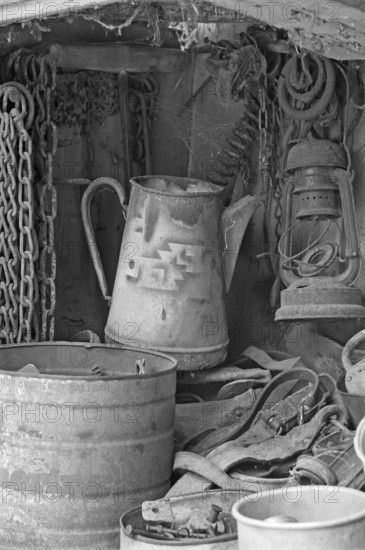 Chains, old coffee pot and collected utensils in an old cupboard on a farm, Middle Franconia, Bavaria, Germany