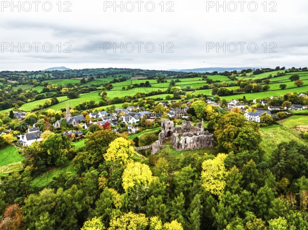 Autumn Colours over ruins of Grosmont Castle from a drone, Grosmont, Monmouthshire, Wales, UK