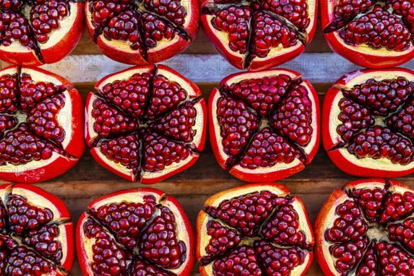 Pomegranate (Punica granatum), halved with red seeds, fruit, food, stand at the Asiatic Riverfront, Bangkok, Thailand's metropolis, Thailand