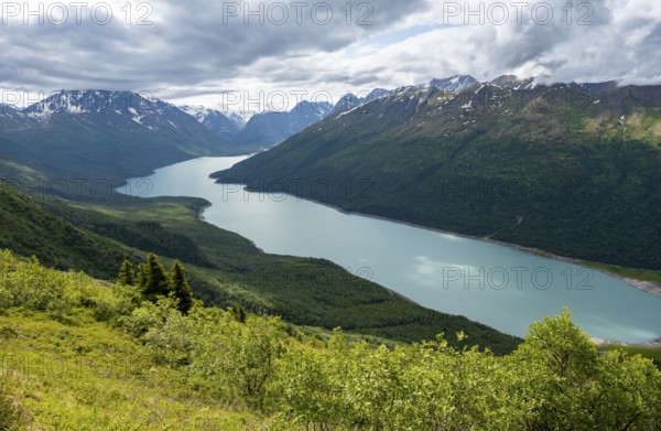 View of blue lake and mountains on Twin Peaks Trail, Eklutna Lake, Chugach Mountains, Chugach State Park, Alaska, USA