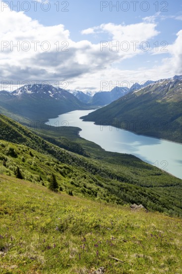 View of blue lake and mountains on Twin Peaks Trail, Eklutna Lake, Chugach Mountains, Chugach State Park, Alaska, USA