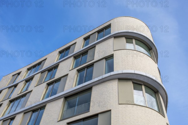 Modern building, detailed view of a residential building, apartment building with large glass façade and rounded corners under clear blue sky, Tuttlingen, Tuttlingen district, Baden-Württemberg, Germany