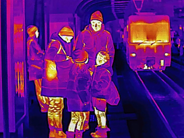 Thermal image or thermography, symbolic photo, interpolated. A family with children is waiting for the light rail on the platform. Stuttgart, Baden-Württemberg, Germany