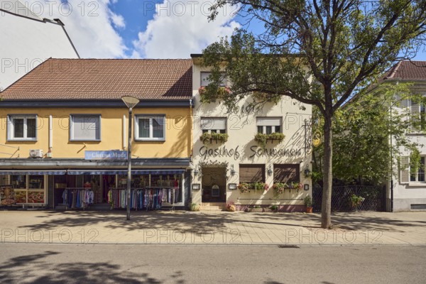 Gasthof Schwanen, Cheema fashion store, commercial building, lantern, city trees, blue sky, cumulus clouds, main street, Kehl, Upper Rhine Valley, Ortenaukreis, Baden-Württemberg, Germany