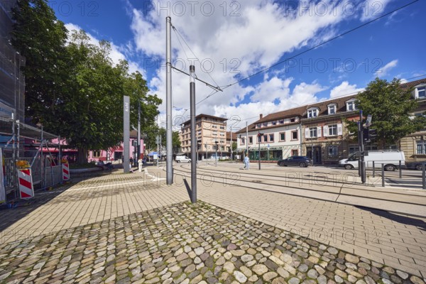 General architecture, commercial buildings, residential buildings, houses, overhead lines, tram tracks, trees, blue sky, cumulus clouds, intersection of main street with Grand Ducal Friedrich-Straß, Kehl, Upper Rhine Plain, Ortenaukreis, Baden-Württemberg, Germany