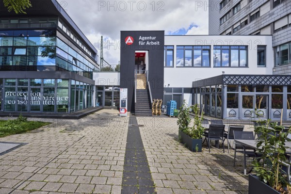 Employment agency, modern architecture, commercial building, outdoor area of a restaurant, cloudy, slightly sunny, diffuse light, cumulus congestus clouds, Bahnhofsplatz, Kehl, Upper Rhine Plain, Ortenaukreis, Baden-Württemberg, Germany
