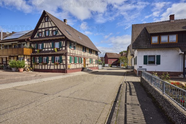 Historic half-timbered house, houses, general development, street, blue sky, cumulus clouds, district road K5329, Hanauerlandstraße, district Hohnhurst, Kehl, Upper Rhine Plain, Ortenaukreis, Baden-Württemberg, Germany