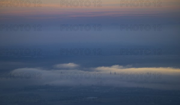 Aerial view of the city of Heidelberg on the Neckar, fog landscape of low-hanging clouds and fog fields floating and waving in the evening light over the Upper Rhine plain in the Rhine-Neckar metropolitan region, Heidelberg, Baden-Württemberg, Germany