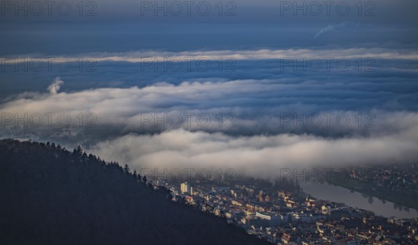 Aerial view of the city of Heidelberg on the Neckar, fog landscape of low-hanging clouds and fog fields floating and waving flat above the roofs of the city and the Neckar, Heidelberg, Baden-Württemberg, Germany