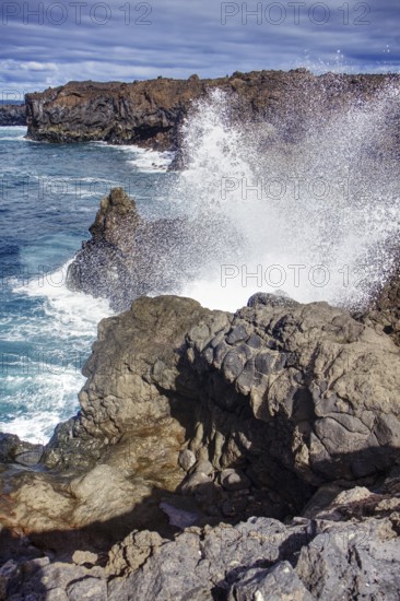 Coastal scene with waves breaking against rocks under a cloudy sky, Playa del Janubio, Yaiza Lanzarote