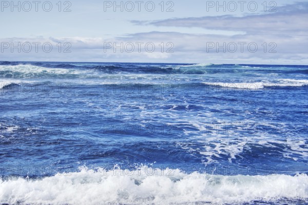 Extensive ocean with foaming waves under a partly cloudy sky, Playa del Janubio, Yaiza Lanzarote