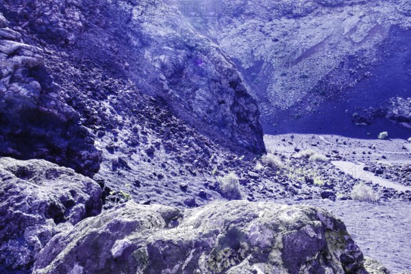 Dry, rocky terrain with rocky formations and soft lighting conditions, El Cuervo volcanic crater, Tinajo Lanzarote