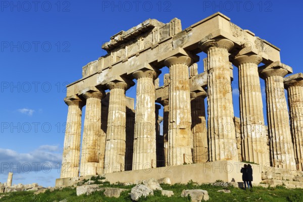 Temple E, Temple of Hera in the ancient Greek city of Selinunte, acropolis, Doric style, archaeological site, restoration, walkers, Selinunte, Castelvetrano, Trapani, Sicily, Italy
