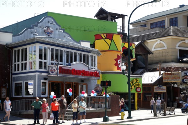 Colourful buildings and passers-by on the main road in Gatlinburg, USA, Gatlinburg, Tennessee, USA