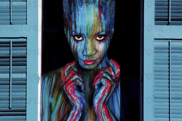 Graffiti art in vibrant colors adorns a window in the French Quarter, New Orleans, Louisiana, USA