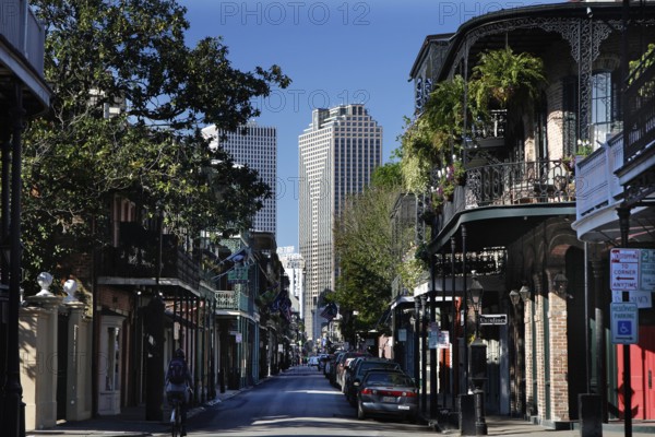 Charming street in the French Quarter with skyscraper in the background, New Orleans, Louisiana, USA