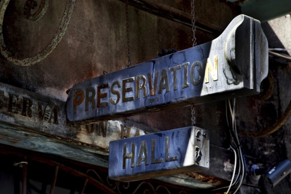 Worn sign at the entrance to Preservation Hall, historic significance, New Orleans, Louisiana, USA