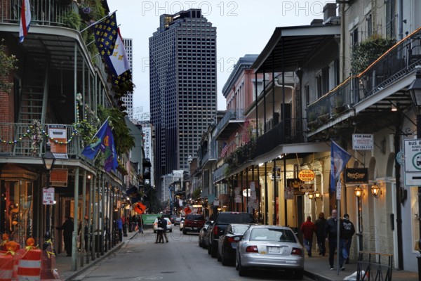 Nocturnal street scene in the French Quarter with illuminated buildings and cars, New Orleans, Louisiana, USA