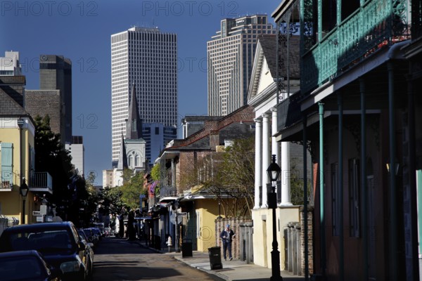 View of French Quarter streets with modern skyscrapers in the background, New Orleans, Louisiana, USA